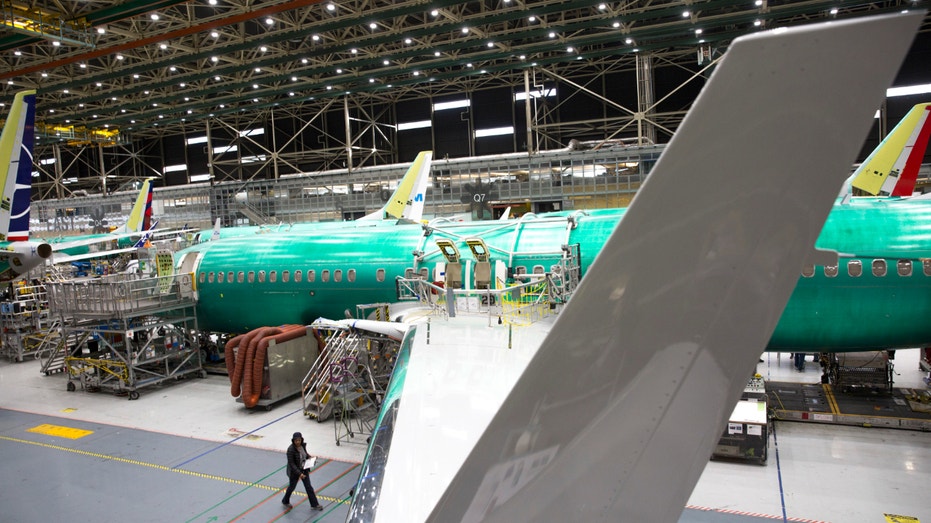 Employees work on Boeing 737 Max airplanes at the Boeing Renton Factory in Renton, Washington on March 27, 2019.