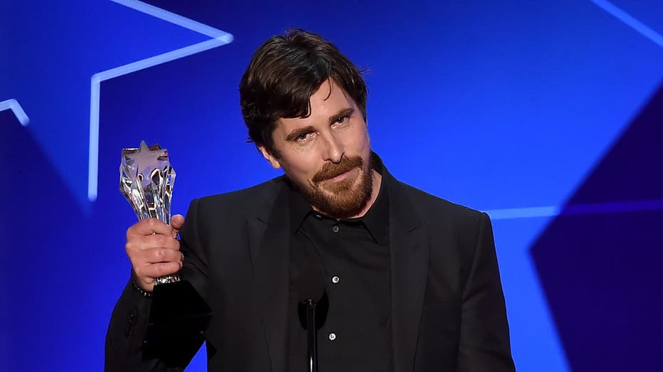 Christian Bale holds trophy at the 21st Annual Critics' Choice Awards