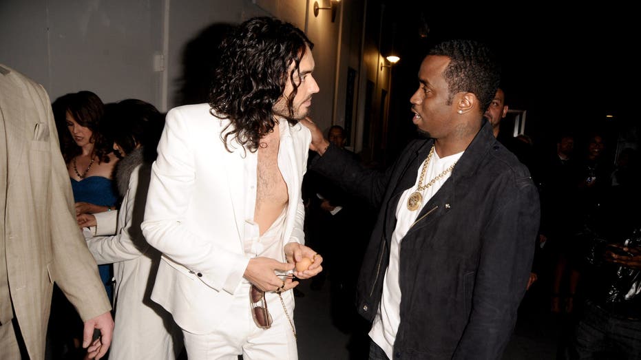 Russell Brand and Sean "Diddy" Combs talk at the premiere of "Get Him to the Greek"