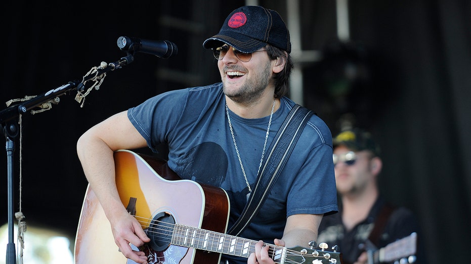 Eric Church plays the guitar