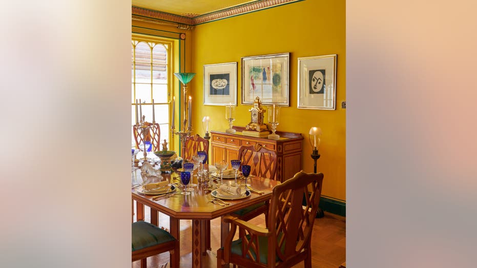 A dining room with yellow walls
