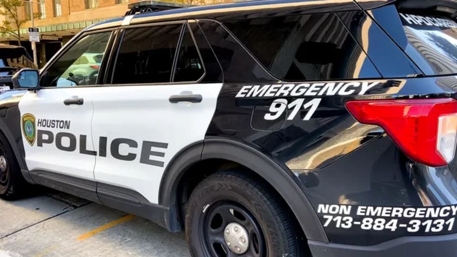 An image of a black and white colored Houston Police cruiser