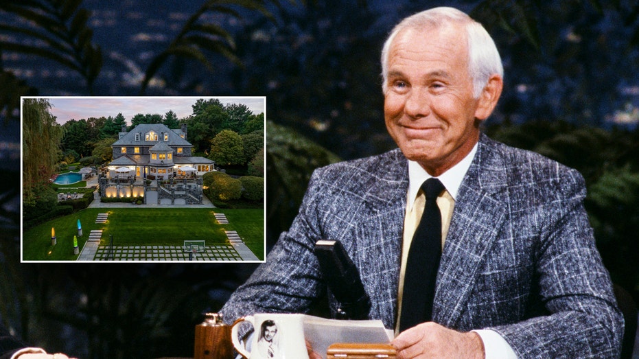 Johnny Carson smiling at his desk with an inset of a picture of his home surrounded by grass and trees.