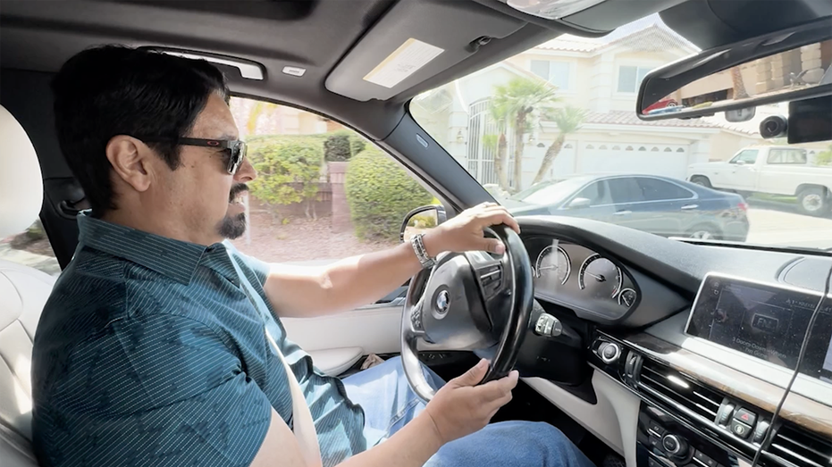 A man driving his BMW