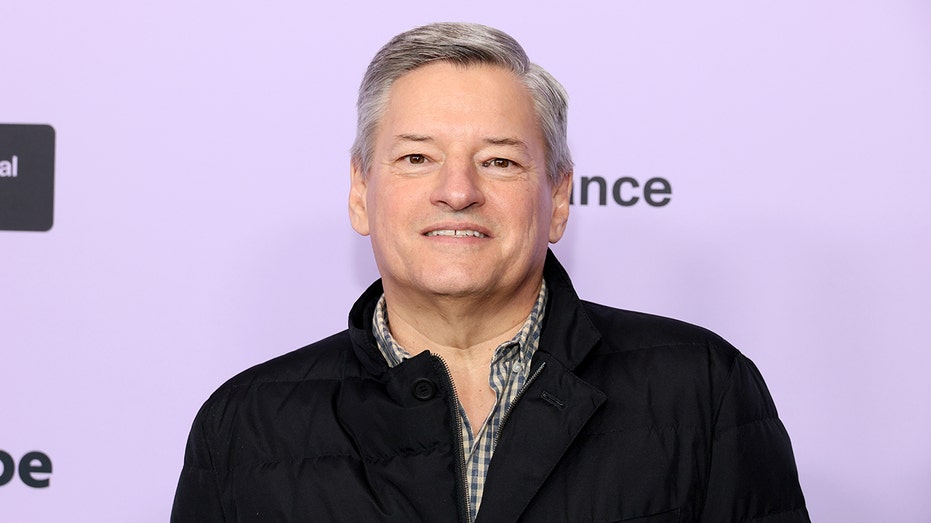 Ted Sarandos smiling on the red carpet