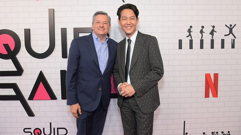 Ted Sarandos and Squid Game star Lee Jung-jae posing together on the red carpet