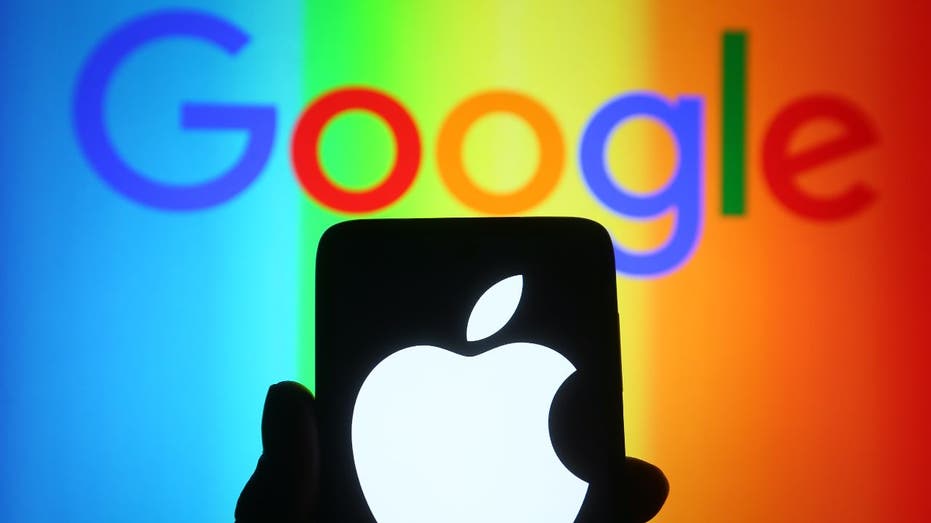 Google logo behind apple log on iphone