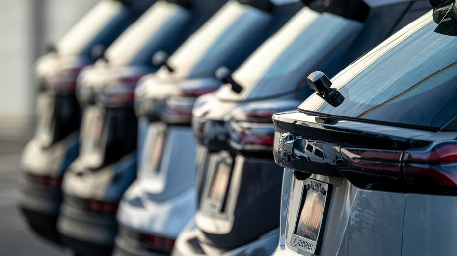 chevrolet bolts lined up at a dealership