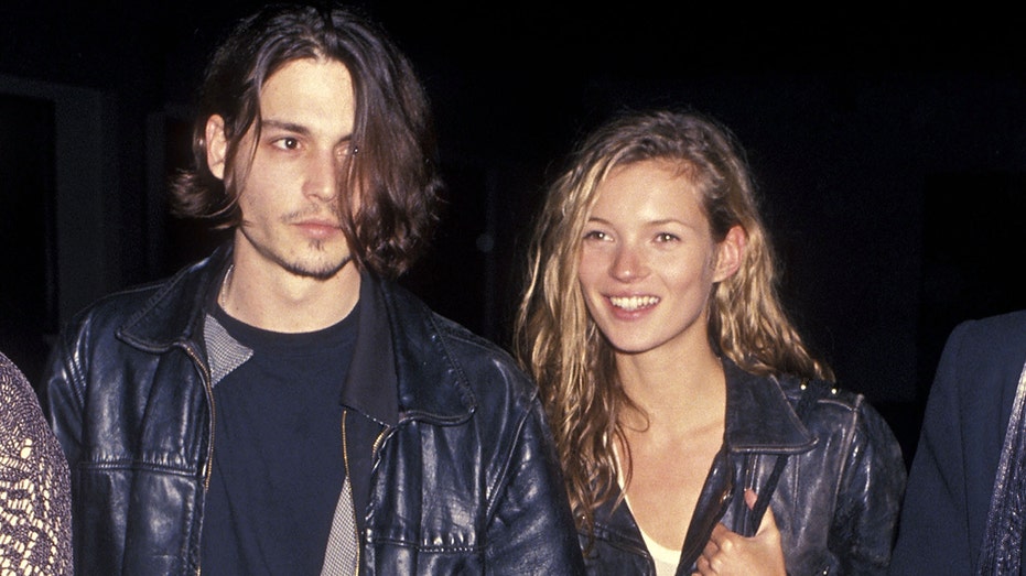 Johnny Depp and Kate Moss both wearing black