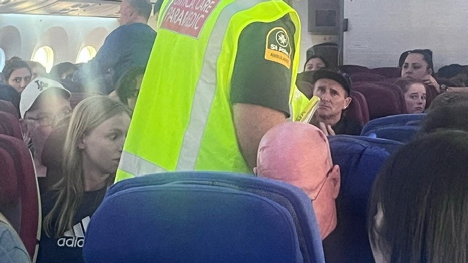 A paramedic pictured on a LATAM Airlines Boeing 787, in Auckland, New Zealand, after the plane landed.