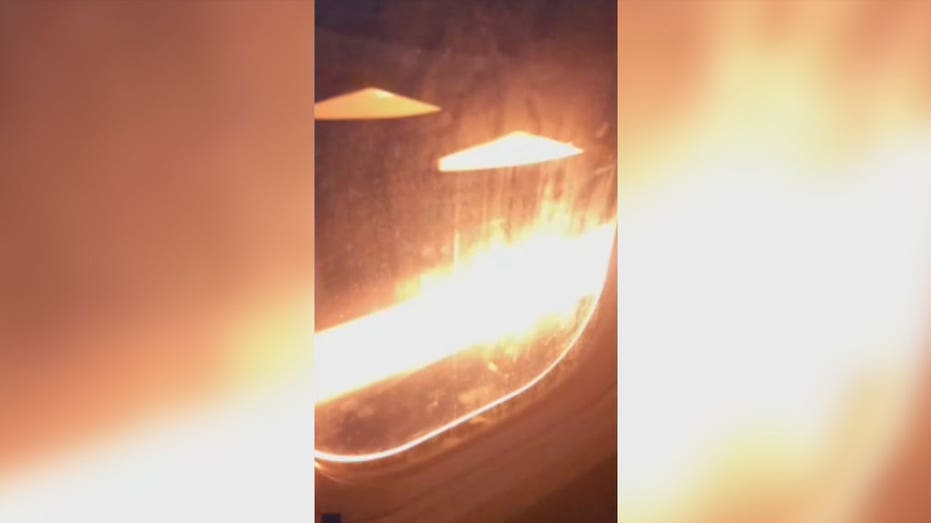 Flames seen shooting from engine of United Airlines flight before