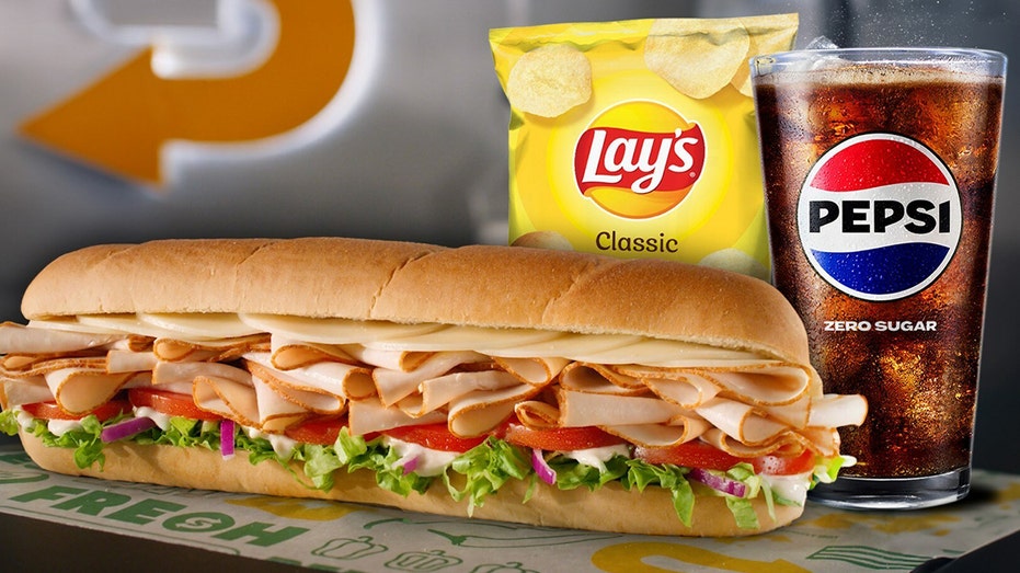 Subway sandwich with Lays chips and Pepsi drink