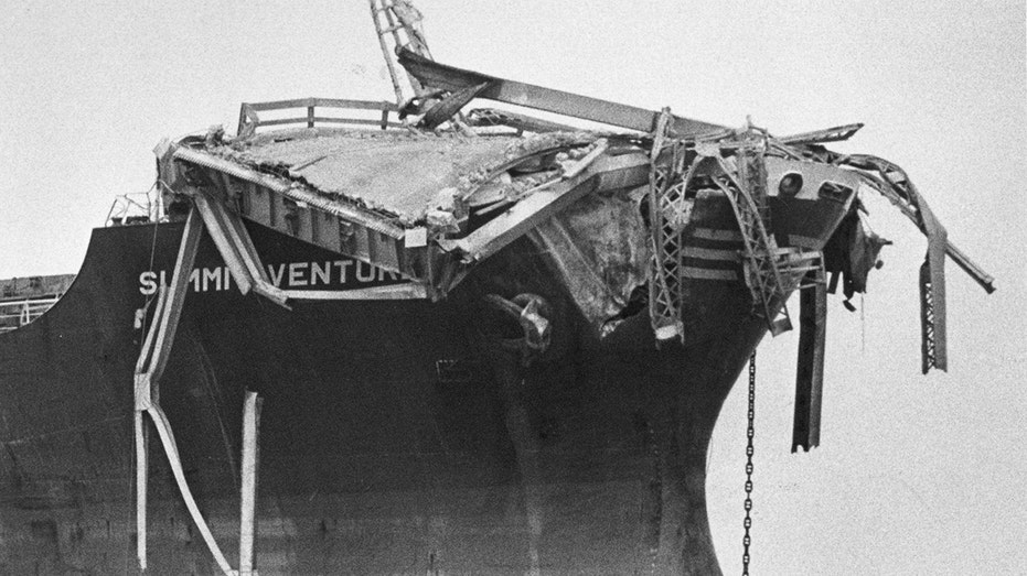 Boat with bridge wreckage