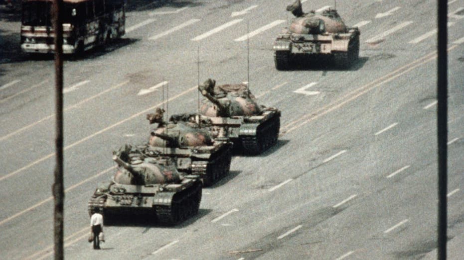 Iconic photograph of man facing down tanks successful Tiananmen Square