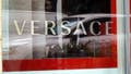 A sign marks the location of a Versace store on August 10, 2023 in Chicago, Illinois. Tapestry, the luxury fashion company that owns Coach and Kate Spade, has purchased Capri Holdings, the parent of Versace and Michael Kors. 