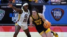 Caitlin Clark #22 of the Iowa Hawkeyes dribbles around Raven Johnson #25 of the South Carolina Gamecocks in the second half during the 2024 NCAA Women&apos;s Basketball Tournament National Championship at Rocket Mortgage FieldHouse on April 07, 2024 in Cleveland, Ohio.