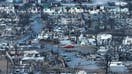 In an aerial view, burned cars and homes are seen in a neighborhood that was destroyed by a wildfire on August 18, 2023 in Lahaina, Hawaii. At least 111 people were killed and thousands were displaced after a wind driven wildfire devastated the towns of Lahaina and Kula early last week. Crews are continuing to search for missing people. 