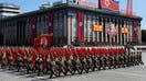 Soldiers march with the portrait of North Korean founder Kim Il Sung during a military parade marking the 70th anniversary of country&apos;s foundation in Pyongyang, North Korea, September 9, 2018.