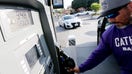 A driver fills up for almost $100 at a gas station in downtown Los Angeles in September 2023. Gas prices are on the rise again in the U.S.
