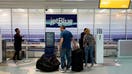 FORT LAUDERDALE, FLORIDA - MAY 16: Passengers drop their checked in bags with JetBlue Airlines in the Fort Lauderdale-Hollywood International Airport on May 16, 2022 in Fort Lauderdale, Florida. JetBlue announced it is taking a hostile position in its effort to acquire Spirit Airlines. Spirit previously rejected a takeover offer from JetBlue, favoring an earlier deal to merge with Frontier airlines. (Photo by Joe Raedle/Getty Images)  - Fox Business News