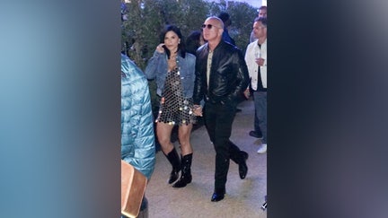 ONE TIME USAGE ONLY Jeff Bezos and fiancee Lauren Sanchez enjoys Tyler, The Creator's headlining set during the first weekend of the Coachella Valley Music and Arts Festival in Indio, California on Saturday, April 13, 2024.