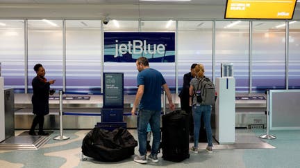 FORT LAUDERDALE, FLORIDA - MAY 16: Passengers drop their checked in bags with JetBlue Airlines in the Fort Lauderdale-Hollywood International Airport on May 16, 2022 in Fort Lauderdale, Florida. JetBlue announced it is taking a hostile position in its effort to acquire Spirit Airlines. Spirit previously rejected a takeover offer from JetBlue, favoring an earlier deal to merge with Frontier airlines. (Photo by Joe Raedle/Getty Images)  - Fox Business News