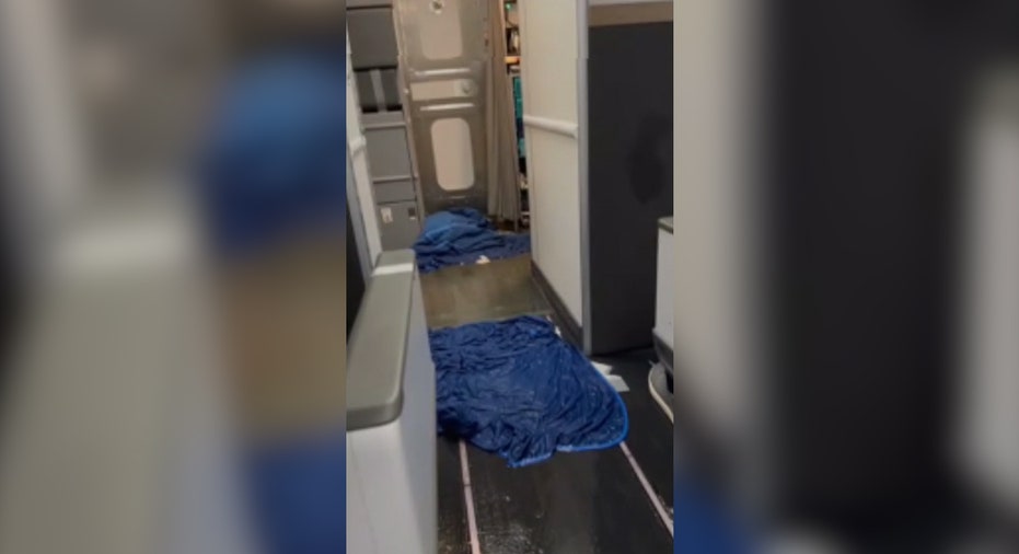 Blue blankets on flooded plane's floor