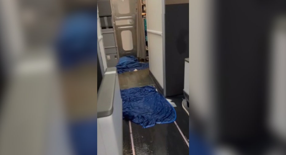 Blue blankets on flooded plane's floor