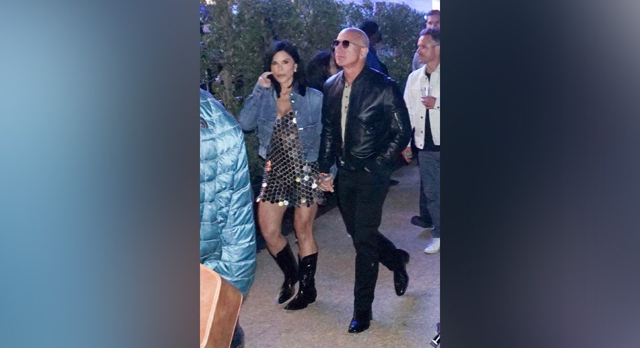 ONE TIME USAGE ONLY Jeff Bezos and fiancee Lauren Sanchez enjoys Tyler, The Creator's headlining set during the first weekend of the Coachella Valley Music and Arts Festival