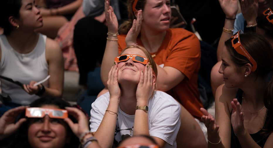 Students take in the eclipse while listening to Mariachi Paredes de Tejastitlán at the University of Texas in Austin, Tennessee