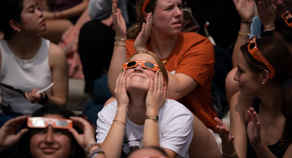 Students take in the eclipse while listening to Mariachi Paredes de Tejastitlán at the University of Texas in Austin, Tennessee