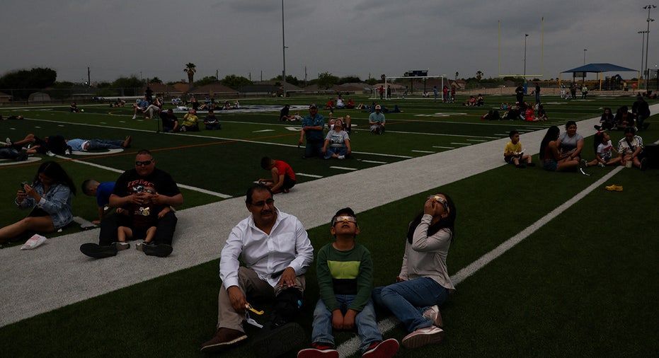 People watch a total solar eclipse in Eagle Pass, Texas