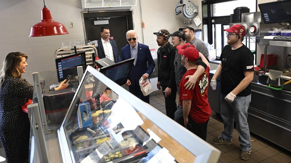 Biden standing with Sheetz employees