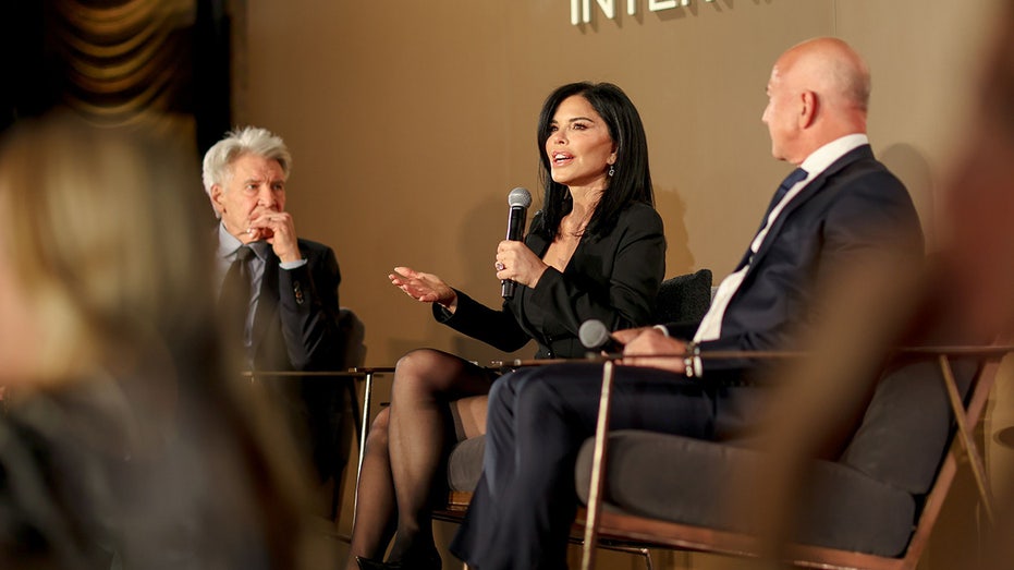 Harrison Ford speaks to Lauren Sánchez and Jeff Bezos during a panel at the Conservation International 2024 Gala