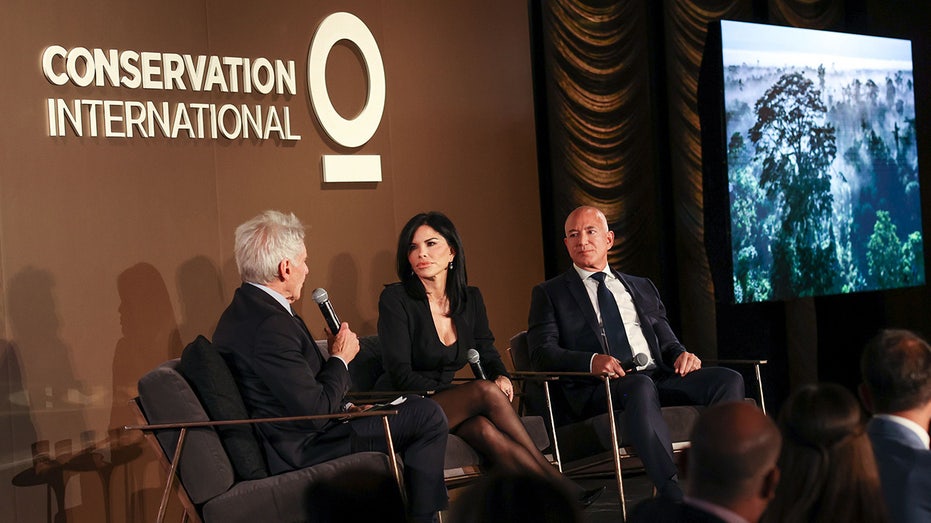 Harrison Ford speaks to Lauren Sánchez and Jeff Bezos during a panel at the Conservation International 2024 Gala