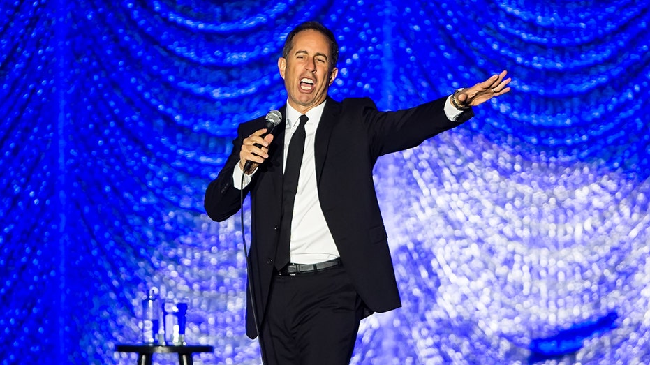 Jerry Seinfeld on stage doing standup comedy