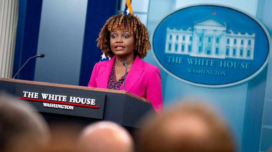 White House press secretary speaking at the podium