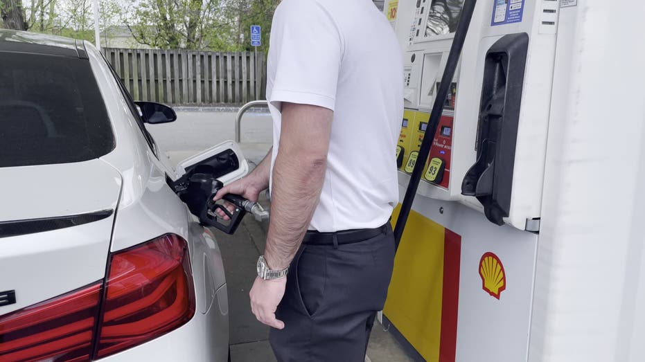 Man filling up gas tank