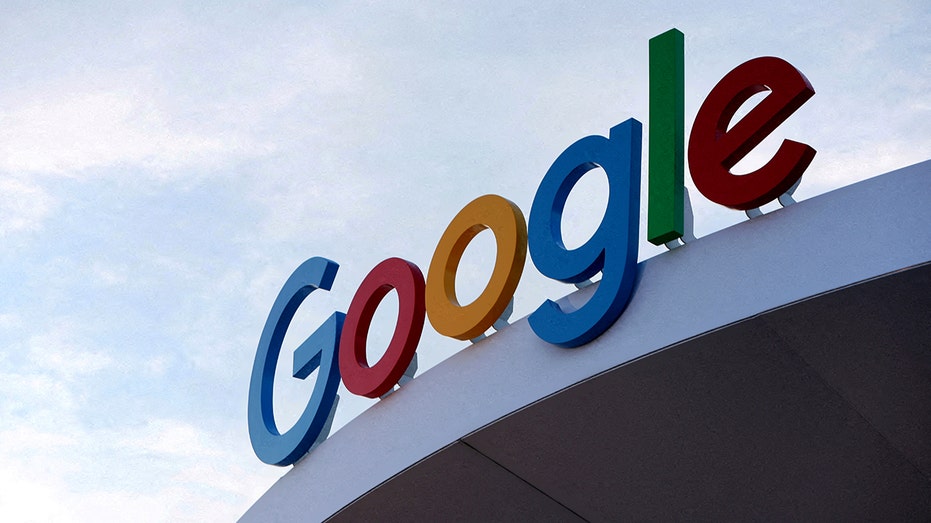 closeup of Google logo atop building