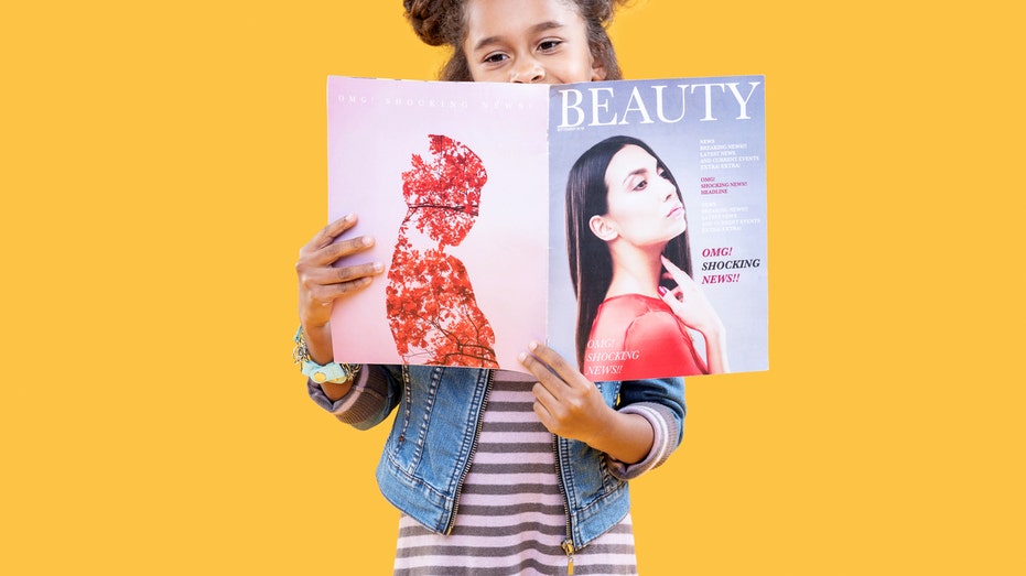 Girl reading beauty magazine
