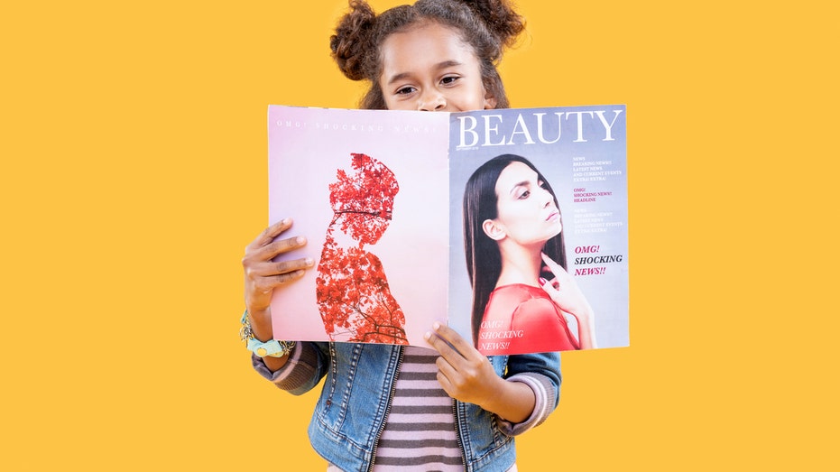 Girl reading beauty magazine