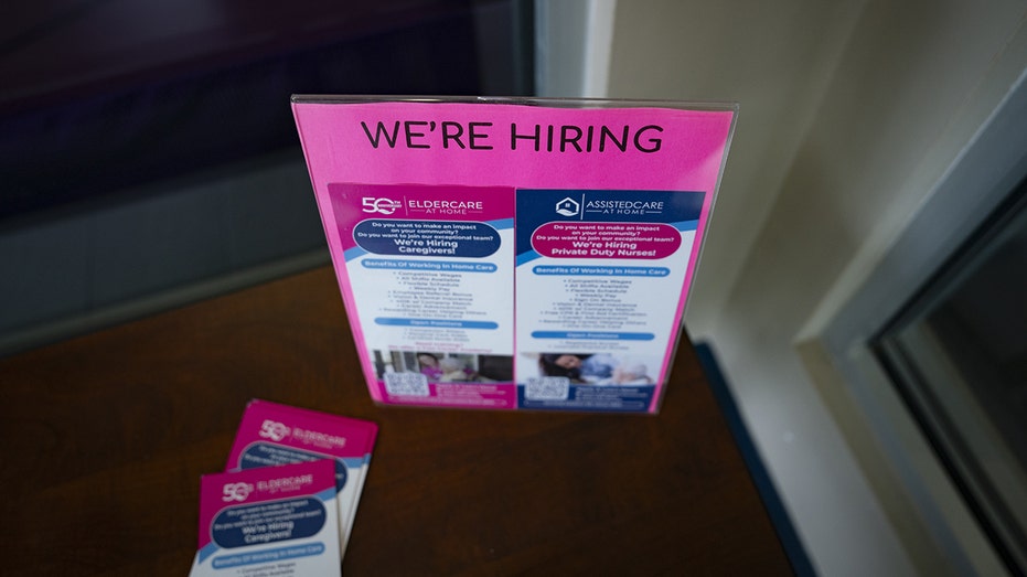 A "We're Hiring" sign at a North Carolina jobs fair