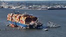 BALTIMORE, MARYLAND - MAY 13: In this aerial view, a steel truss from the destroyed Francis Scott Key Bridge that was pinning the container ship Dali in place was detached from the ship using a controlled detonation of explosives in the Patapsco River on May 13, 2024 in Baltimore, Maryland. An estimated 500-foot section of the bridge weighing 8-12 million pounds was removed by controlled demolition in the final stage of wreckage removal for the ship to be moved into port. On March 26th the Dali crashed into the Key Bridge causing it to collapse killing six construction workers. 