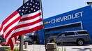 An American flag flies at a Chevrolet dealership on August 4, 2021 in Glendale, California.