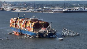 Container ship that caused bridge collapse to be moved out of channel