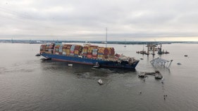 Container ship that collapsed Baltimore bridge refloated, moved to port terminal