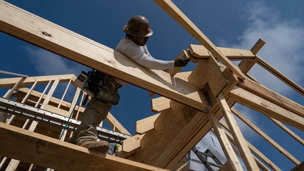 Workers build homes in Lillington, North Carolina, US, on Thursday, June 15, 2023. The US Census Bureau is scheduled to release housing starts figures on June 20. 