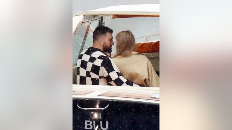 Taylor Swift and Travis Kelce on a boat in Lake Como