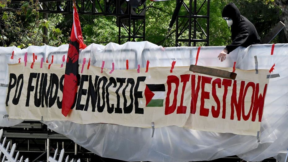 Protesters holding BDS sign