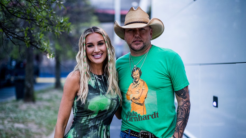 Brittany Aldean and Jason Aldean posing together